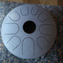 A N’goni Skipping Stone, 9 note steel tongue drum