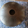 A N’goni Skipping Stone, 9 note steel tongue drum