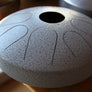 A N’goni Skipping Stone, 9 note steel tongue drum